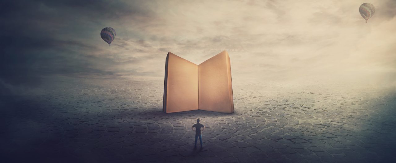 Surreal scene, imaginary world, tiny man stands in front of a giant opened book with empty blank pages. Education concept, the magic and fantasy of a story teller. Knowledge and wisdom symbol.