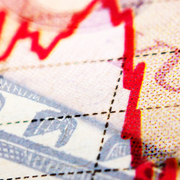 Yuan, Dollar, and Euro overlapping banknotes