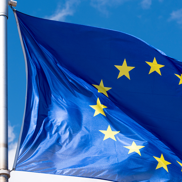 EU Flag waving against blue sky