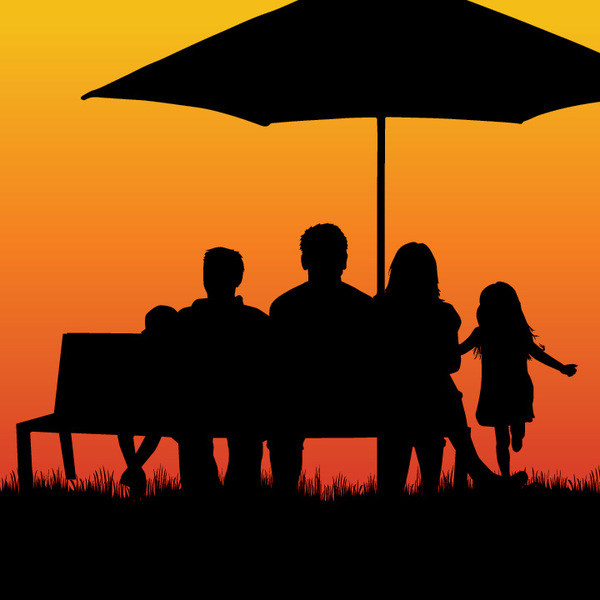 family on bench at sunset