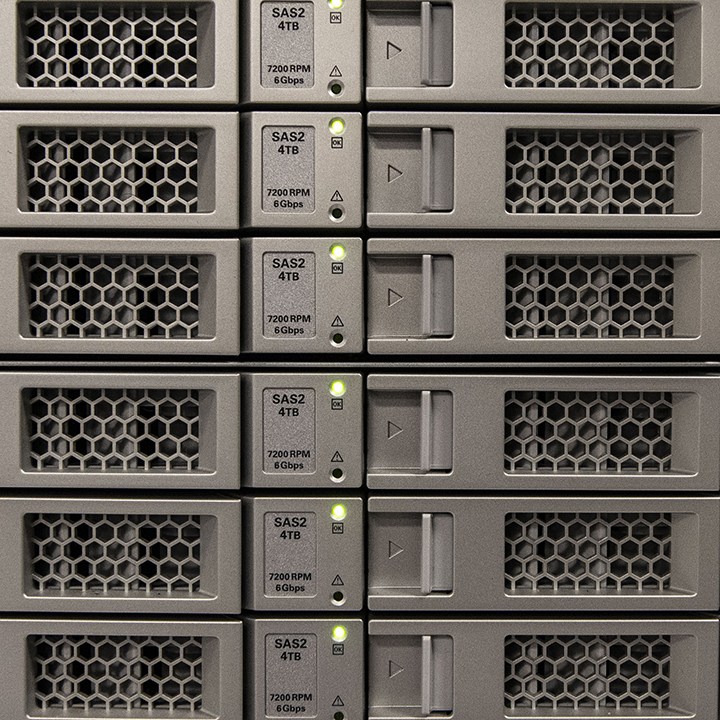 2 BBH'ers Sitting at Their Computers in Data Center