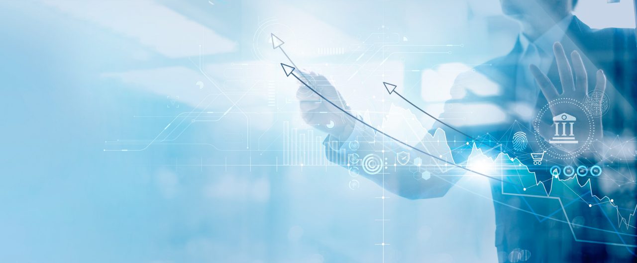 Businessman analyzing data and drawing graph