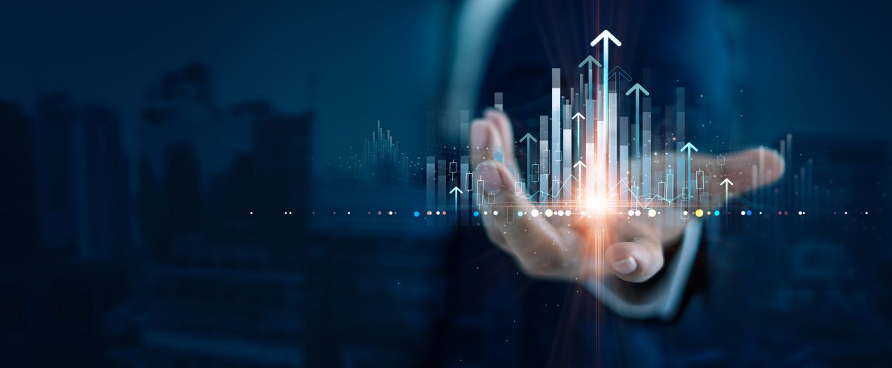 Businessman holding structure graph chart of business investment