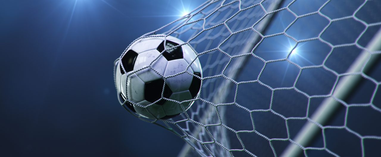 Football hitting the back of  a goal net